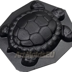 May include: A black plastic mold shaped like a turtle, designed for making concrete garden decorations.