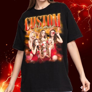May include: Black t-shirt featuring a graphic print of a group of women in red outfits holding lollipops. The text "CUSTOM Name" is printed in a retro style above the graphic.