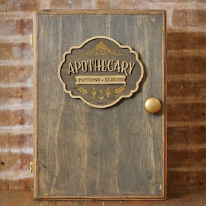 Rustic wooden apothecary-style box with bronze and gold accents with 'Apothecary Potions & Elixirs' label on a wooden background
