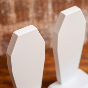 detailed view of a pair of gothic bookend coffin shaped book holder for table, bookshelf, or book case