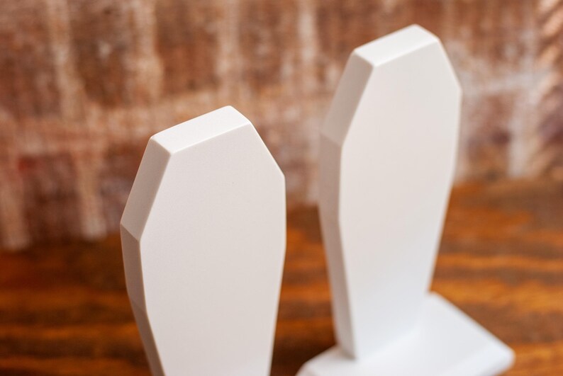 detailed view of a pair of gothic bookend coffin shaped book holder for table, bookshelf, or book case
