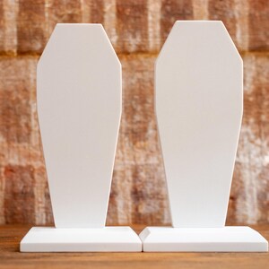 side-by-side view of a pair of gothic bookend coffin shaped book holder for table, bookshelf, or book case