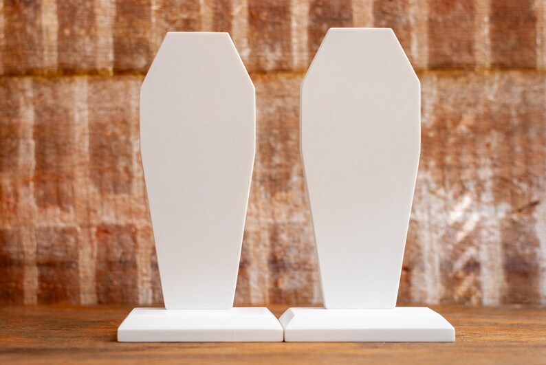 side-by-side view of a pair of gothic bookend coffin shaped book holder for table, bookshelf, or book case