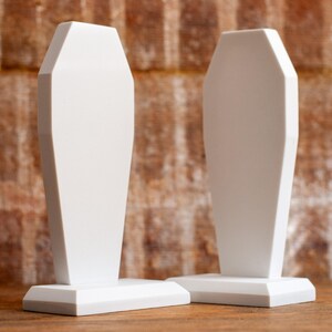 front view of two gothic coffin bookends, book holders for table, bookshelf, or book case, book shelf accessories
