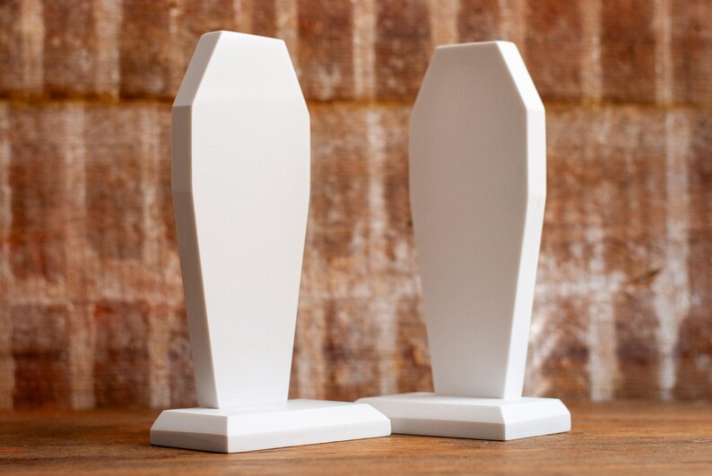 front view of two gothic coffin bookends, book holders for table, bookshelf, or book case, book shelf accessories