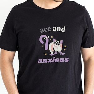 May include: Black t-shirt with a graphic of a sugar glider and the text "ace and anxious".