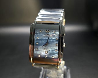 Orologio Technos rettangolare vintage, quadrante con motivo a conchiglia messicana, cassa in carburo di tungsteno, vetro zaffiro.
