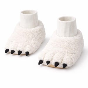 May include: A pair of novelty white bear paw slippers. The slippers have a plush, furry texture with black claws and ribbed white ankle cuffs. The soles are a light tan color.