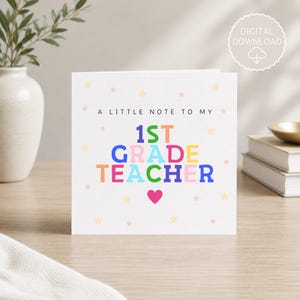 May include: A white greeting card with the text "A LITTLE NOTE TO MY 1ST GRADE TEACHER" in colorful letters. The card has a pink heart and small star illustrations. A digital download icon is in the upper right corner.