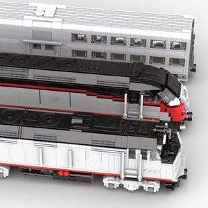 May include: A white and red model train with black accents. The train has a locomotive and a passenger car. The locomotive has a red nose and a black roof. The passenger car has a white body and a black roof.