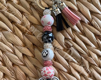 Handmade, dog keychain! Lobster claw clasp on nylon cord, silicone focal bead, paw prints on a wood bead and dog bone prints on a wood bead