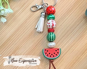 Handmade and very cute, watermelon beaded keychain! Swivel clasp, suede cord, rondelles, silicone watermelon, printed wood beads.