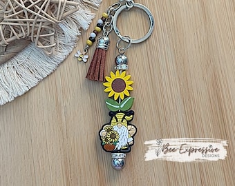 Handmade, wood sunflower bead, and silicone gnome keychain!  Includes a beaded tassel and a bee charm!