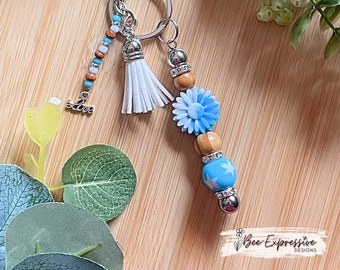 Beautiful, handmade silicone flower keychain with acrylic star imprinted bead! Acrylic beaded tassel with LOVE charm!