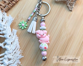 Handmade Pink Pig Keychain: Beaded Tassel, Rhinestones & Daisy Charm
