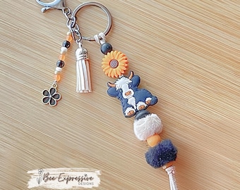 Handmade Cow Keychain: Beaded Tassel, Sunflower Accent