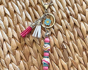 Handmade Beaded Keychain: Iridescent Beads, Daisy Charm, Tassel Accent