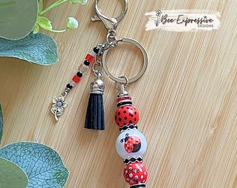 Handmade Ladybug Keychain: Wood Beads, Flower Charm, Black Tassel