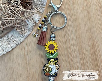 Handmade, wood sunflower bead, and silicone gnome keychain!  Includes a beaded tassel and a bee charm!