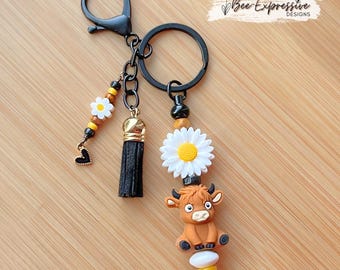 The 3D Cow Beaded Keychain: Daisy Flower, Black Heart Charm