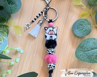 Handmade Cow Keychain: Furry & Wood Beads, Acrylic Tassel, Metal Flower Charm