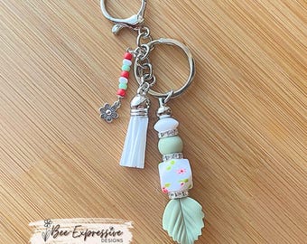 Handmade Beaded Keychain: Floral Hexagon Bead, Silicone Leaf & Tassel