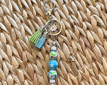Handmade Beaded Keychain: Acrylic Star Bead, Daisy Charm, Tassel Accent