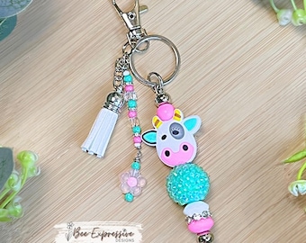 Handmade Cow Beaded Keychain: Turquoise, Rhinestone Bead, Tassel with Flower Charm