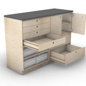 May include: A light wood cabinet with a gray countertop. The cabinet has four drawers, a door with a shelf, and a lower section with three pull-out drawers. Two of the drawers are open, revealing empty space.