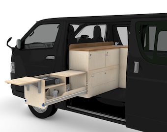 May include: A black van with a custom wooden campervan interior. The interior features a pull-out kitchen unit with a stove, cabinets, and a fold-down table. The cabinets are light-colored wood with a dark wood countertop.