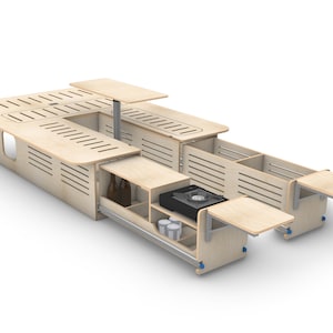 May include: A wooden table with a built-in stovetop and storage drawers. The table has a fold-down extension on one side and a removable top on the other. The table is made of light wood and has a modern design.