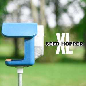 May include: A blue bird feeder with a clear plastic seed hopper labeled "SEED HOPPER XL".