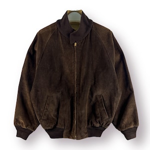 May include: A brown corduroy bomber jacket with a zipper closure and ribbed cuffs and waistband.