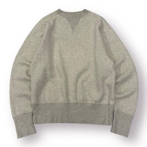 May include: A heather gray sweatshirt with a crew neck and a V-shaped insert at the neckline. The cuffs and hem are a darker shade of gray. The sweatshirt has a relaxed fit and is made of a soft, comfortable material.