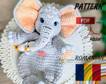 May include: Crochet pattern for a gray elephant amigurumi toy with peach ears and blue eyes. The pattern is available in both English and Romanian languages. PDF download.