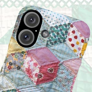 May include: A smartphone case featuring a patchwork quilt design composed of various fabric patterns including light blue stripes, red floral prints, yellow polka dots, and small green shapes arranged in a geometric diamond-tiled pattern.