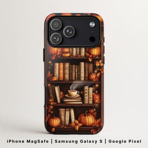 May include: A phone case featuring a bookshelf design with pumpkins, books, and autumn leaves. The case has a dark brown wood-like background and the text "iPhone MagSafe | Samsung Galaxy S | Google Pixel".