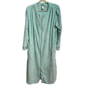 May include: A light teal, full-length robe with a zip-up front and long sleeves. The robe has a textured, paisley-like pattern and is hanging on a wooden hanger. The sleeves have a contrasting trim at the cuffs.