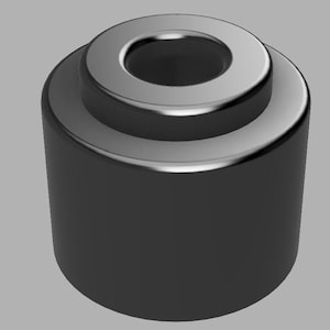 May include: Two black cylindrical objects with a silver top and a hole in the center. The objects are made of a smooth, shiny material.