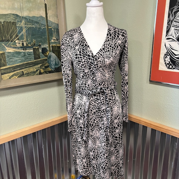 Size small vintage 1990’s Diane Von  Furstenberg 100% silk wraparound dress with spiderweb design
