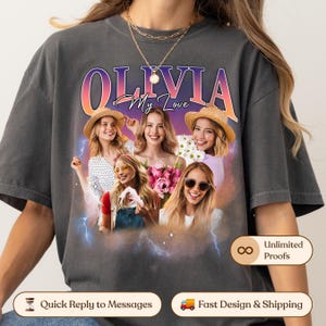 May include: A charcoal grey t-shirt featuring a graphic print with the text OLIVIA My Love. The design includes a collage of five images of a person wearing various outfits, including straw hats and sunglasses, set against a purple and orange gradient background with blue lightning bolt accents.
