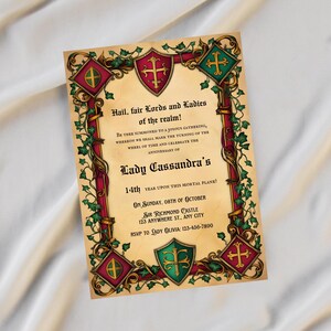 May include: A medieval-style invitation with a red, gold, and green color scheme. The invitation features a shield with a cross and ivy vines. The text reads "Hail, fair Lords and Ladies of the realm! Be thee summoned to a joyous gathering, whereon we shall mark the turning of the wheel of time and celebrate the anniversary of Lady Cassandra's 14th year upon this mortal plane! On Sunday, 08th of October Sir Richmond Castle 123 Anywhere St., Any City RSVP to Lady Olivia: 123-456-7890"