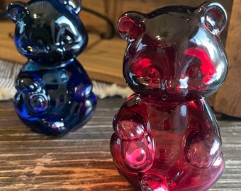 Pair of Fenton Bear Figurines, dark blue solid heavier crystal, dark pink is hollow lighter glass