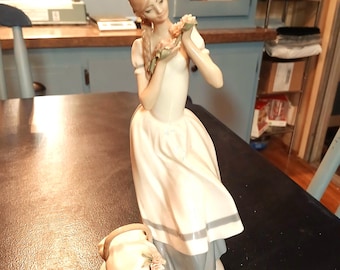 Porcelain sculpture "Cecilia The Carnation Maiden" designed by Lladro sculptor Fulgencio García, 1983 Limited edition.