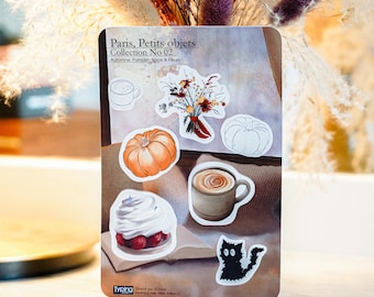 May include: A rectangular sticker sheet titled Paris, Petits objets Collection No 02, Automne, Pumpkin Spice & Fleurs. It features illustrations of a coffee cup, a floral bouquet, two pumpkins, a latte, a dessert, and a black cat.