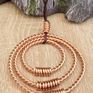 Tensor Necklace With 3 Tensor Rings One I side The Other. Made to 3/8th Lost Cubit, 2/8th 188 MHZ Cubit, And 1/4of A Sacred Cubit