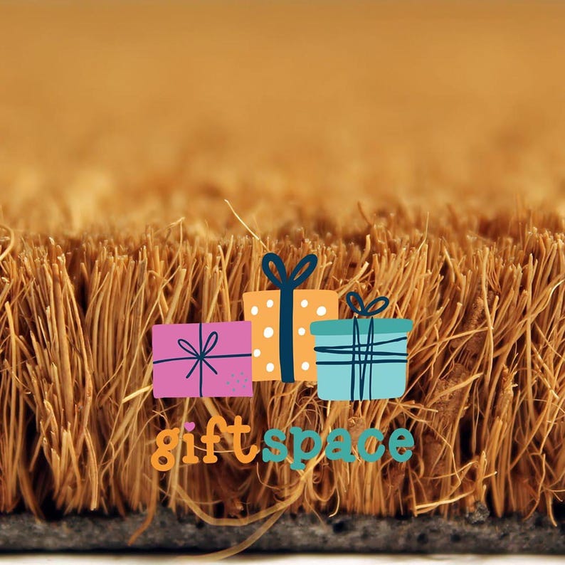 a logo for a gift store, with a close-up view of a textured surface, possibly a carpet or mat, and a small portion of a brown object, possibly a rug or mat, in the foreground.