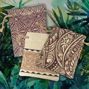 May include: Three rectangular drawstring pouches made of textured fabric. One pouch features a dark purple geometric pattern, another is beige with a brown patterned band, and the third is beige with a dark brown swirling tribal design.