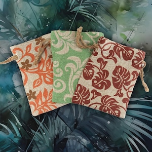 May include: Three rectangular drawstring pouches made of a textured, woven fabric. Each pouch features a distinct botanical print: one in orange, one in light green, and one in dark red. Each bag includes a natural-colored jute drawstring closure.