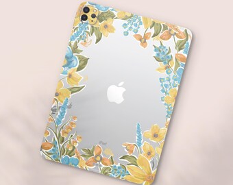 May include: Clear iPad case with a floral design. The case features a border of yellow, blue, and orange flowers and green leaves. The Apple logo is visible on the back of the iPad. The word "iPad" is printed at the bottom.